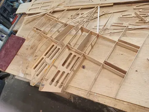 A wooden structure with many pieces of wood.