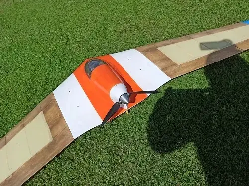 A kite is being held up by the blade.