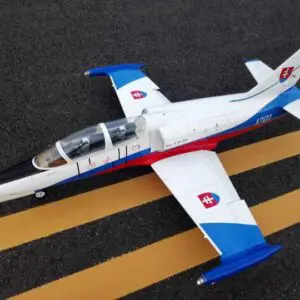 A toy airplane is sitting on the ground.