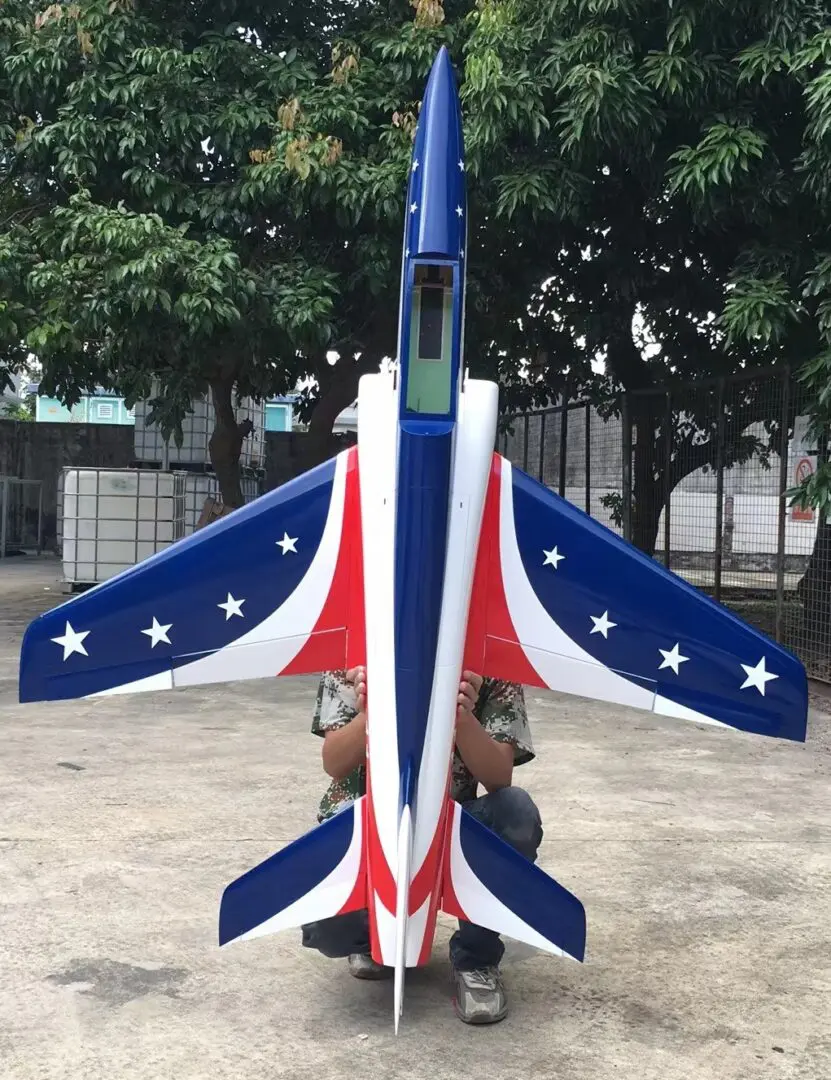 A small jet painted in red, white and blue.