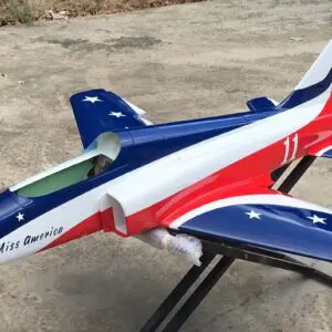 A red white and blue jet plane on display.
