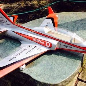 A toy airplane is sitting on the ground.